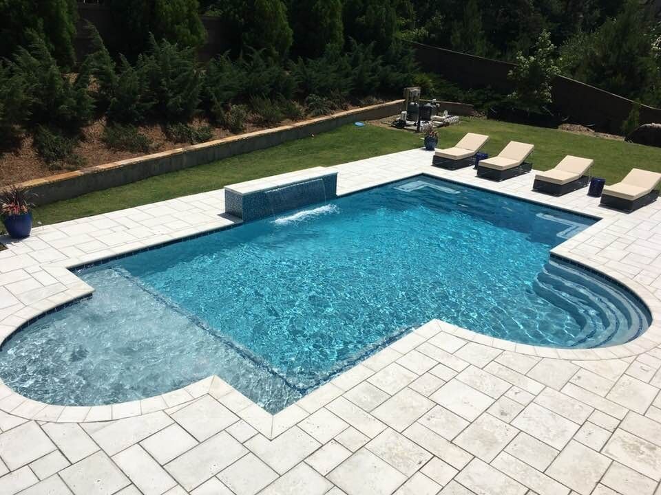 Gunite pool with a wide paver deck