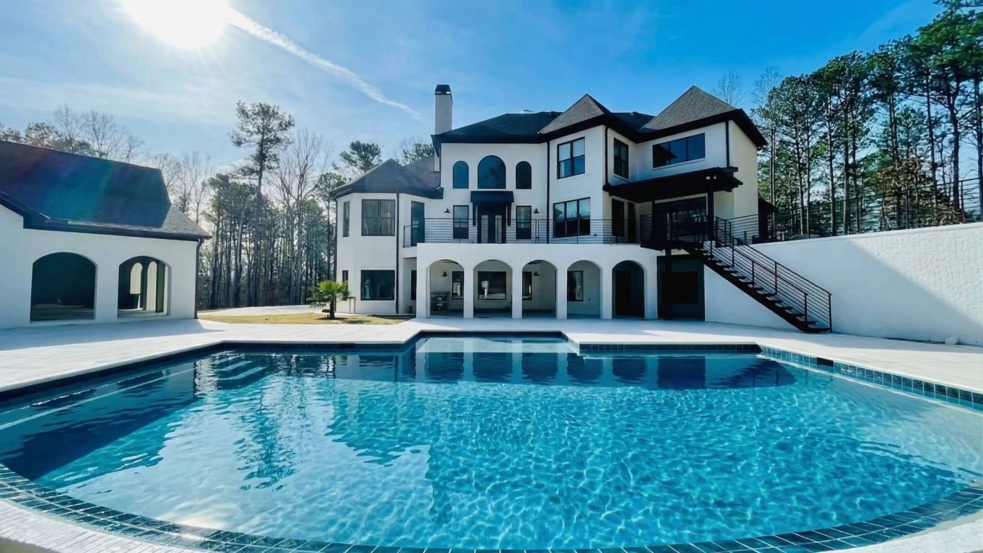 New backyard swimming pool filled with water